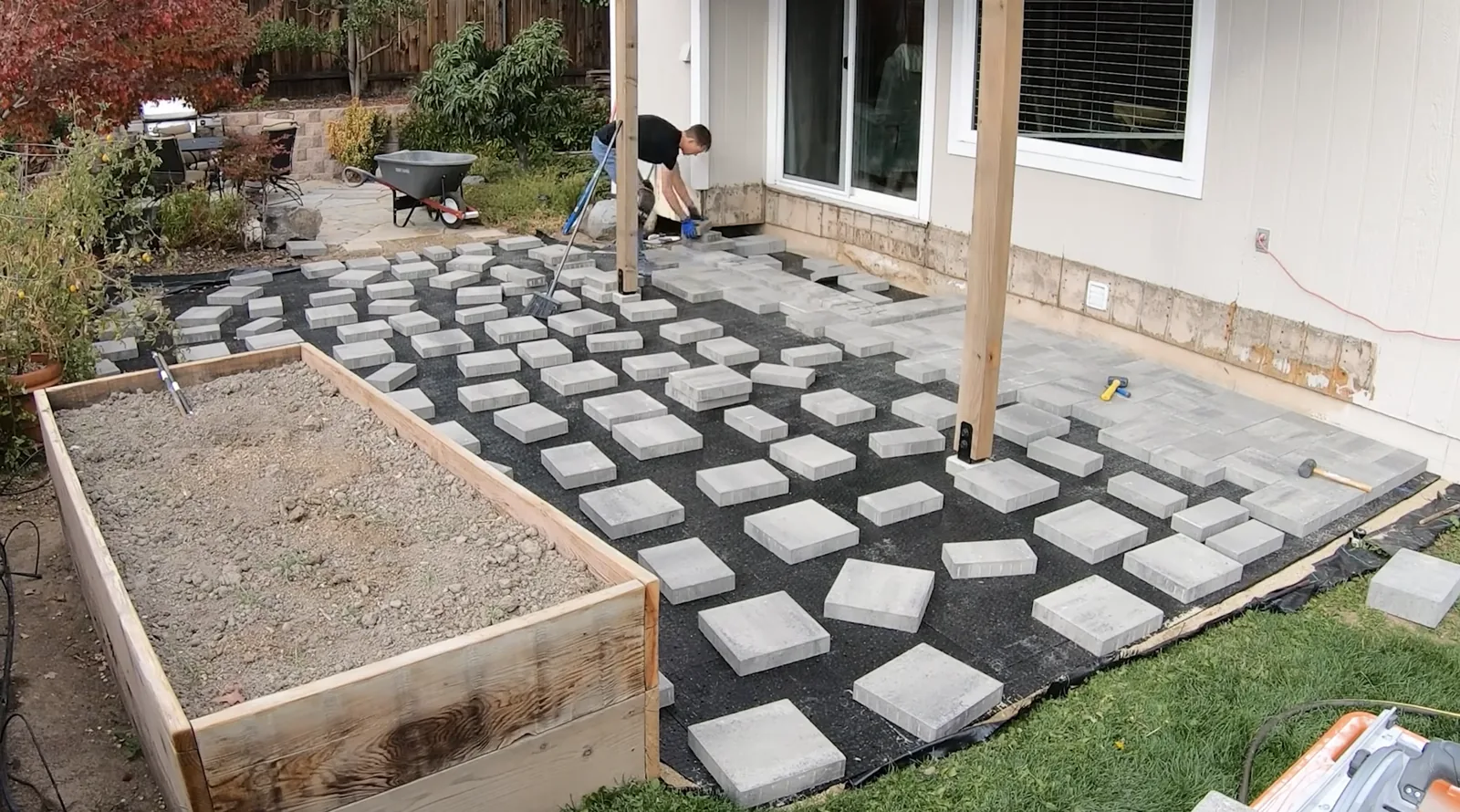 Geotextile fabric and compacted base before laying pavers